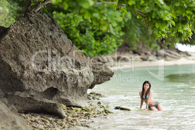 woman swimming on a beautiful lush seashore