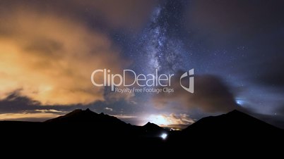 milky way clouds traffic in mountain time lapse pan 11201