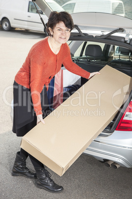 woman invites her package in the car