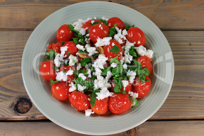 fried mini tomatoes and seasonings, seasoned with parsley and feta cheese