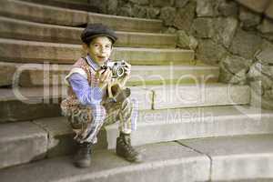 Child with vintage camera