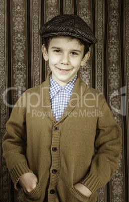 Smiling child in vintage clothes and hat