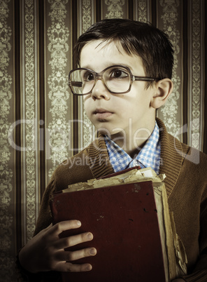 Child with red vintage book