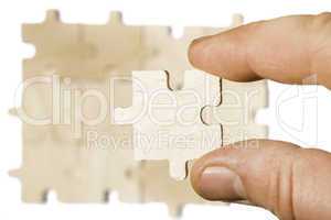 Wooden puzzle on white background. . Close up