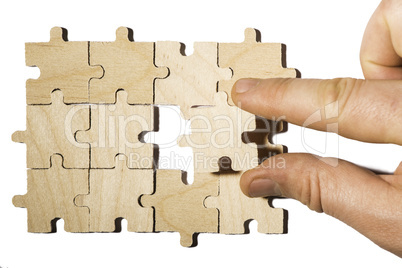 Wooden puzzle on white background. . Close up