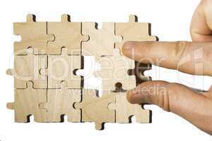 Wooden puzzle on white background. . Close up