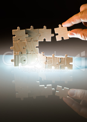Wooden puzzle and backlight background. Close up