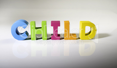 Multicolored text child made of wood.