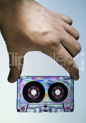 Hand holding vintage cassette tape