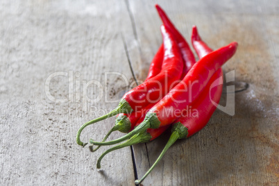 chillies on wooden table