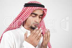 young arab muslim praying