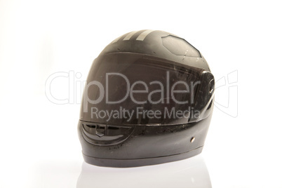 damaged black coloured motor cycle helmet