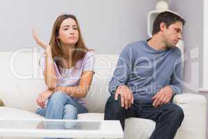 Unhappy couple not talking after argument at home