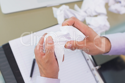 Cropped businessman with diary and crumpled papers
