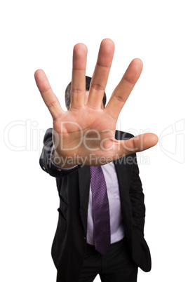 Young businessman with stop gesture