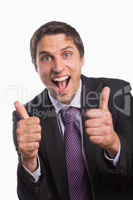 Cheerful businessman gesturing thumbs up