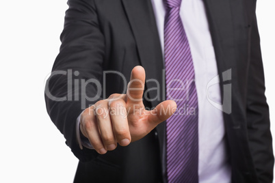 Businessman pointing against white background