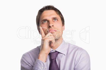 Close-up of a thoughtful businessman looking up