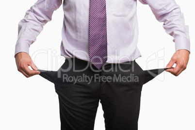 Mid section of a businessman with pockets pulled out