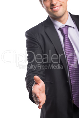 Smiling businessman offering a handshake