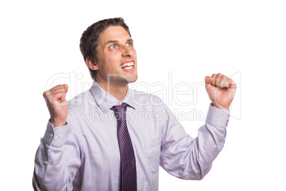 Elegant businessman cheering with clenched hands against white b