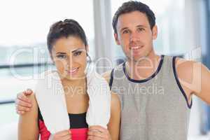 Close-up portrait of a fit couple in exercise room