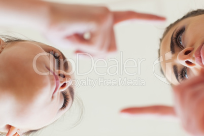 Low angle view of angry young females having an argument