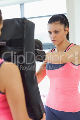 Determined female boxer focused on her training