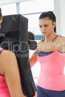 Determined female boxer focused on her training