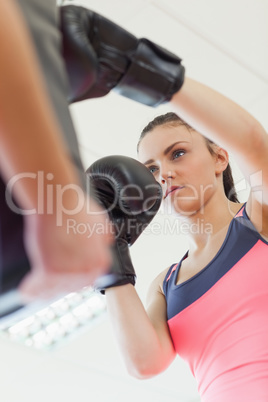 Determined female boxer focused on her training