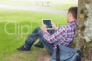 Student using his tablet pc outside