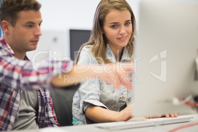 Classmates working together in the computer room