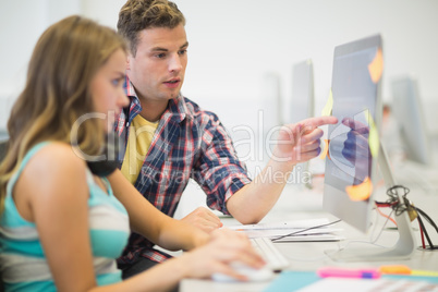 Classmates doing assignment together in the computer room