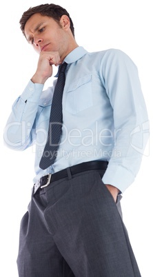 Thoughtful businessman with hand on chin