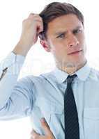 Thinking businessman scratching head