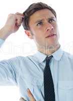 Thinking businessman scratching head