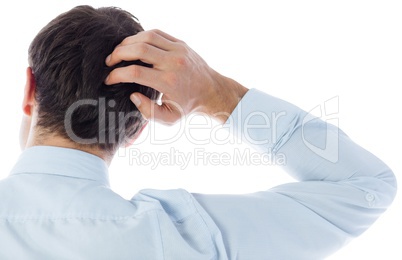 Businessman scratching his head