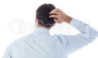 Businessman scratching his head