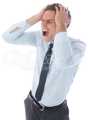 Stressed businessman with hands on head