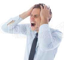 Stressed businessman with hands on head