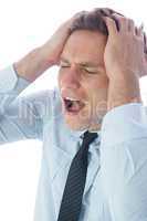 Stressed businessman with hands on head