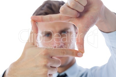 Businessman making frame with hands