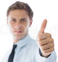 Businessman showing thumbs up