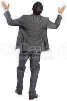 Businessman posing with arms raised