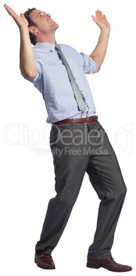 Businessman posing with arms raised