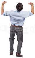 Businessman posing with arms raised