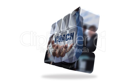 Businessman holding coach text on abstract screen