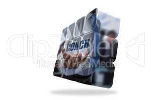 Businessman holding coach text on abstract screen