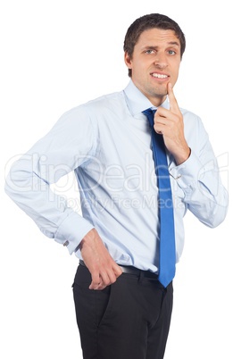 Thinking businessman touching his chin