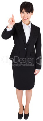 Smiling businesswoman pointing